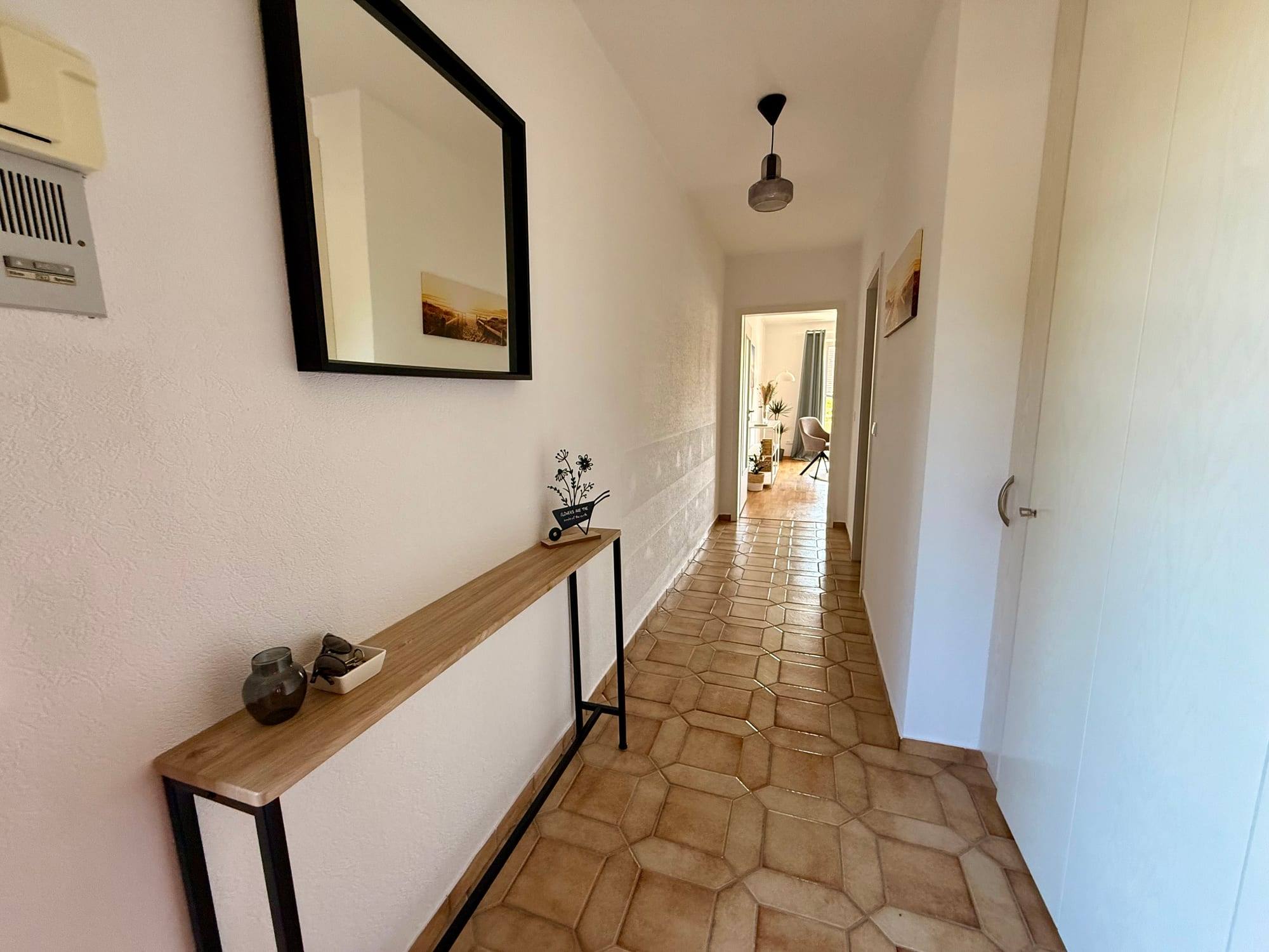 Hallway with mirror and shelf