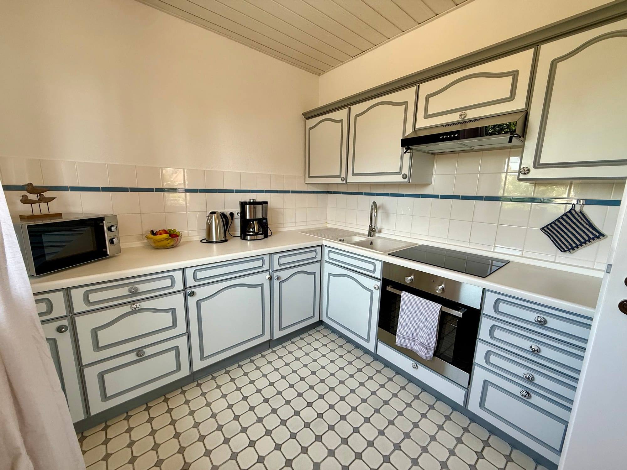 Separate kitchen with oven, ceramic hob and microwave