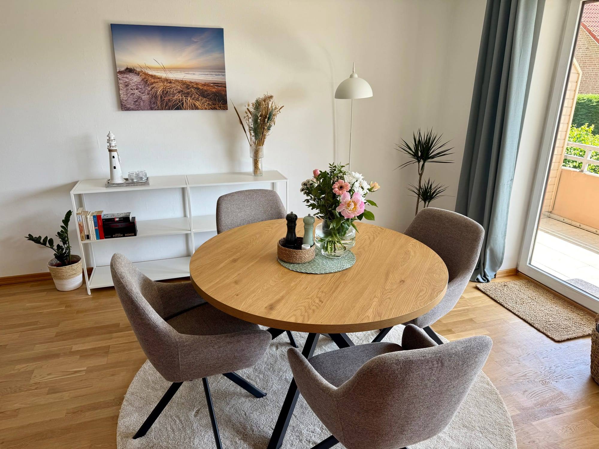 Round dining table with four chairs in the living room