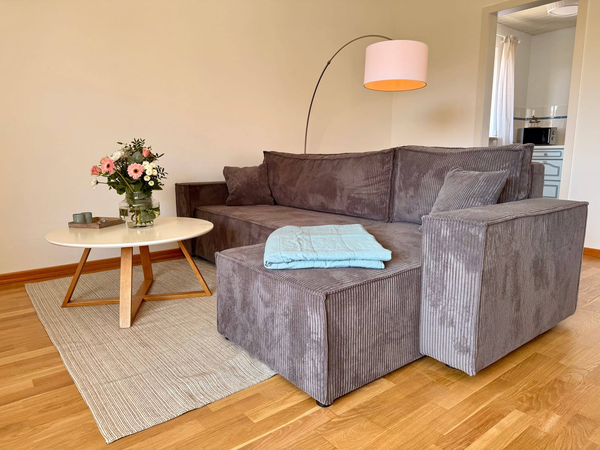 Sofa corner with coffee table and floor lamp