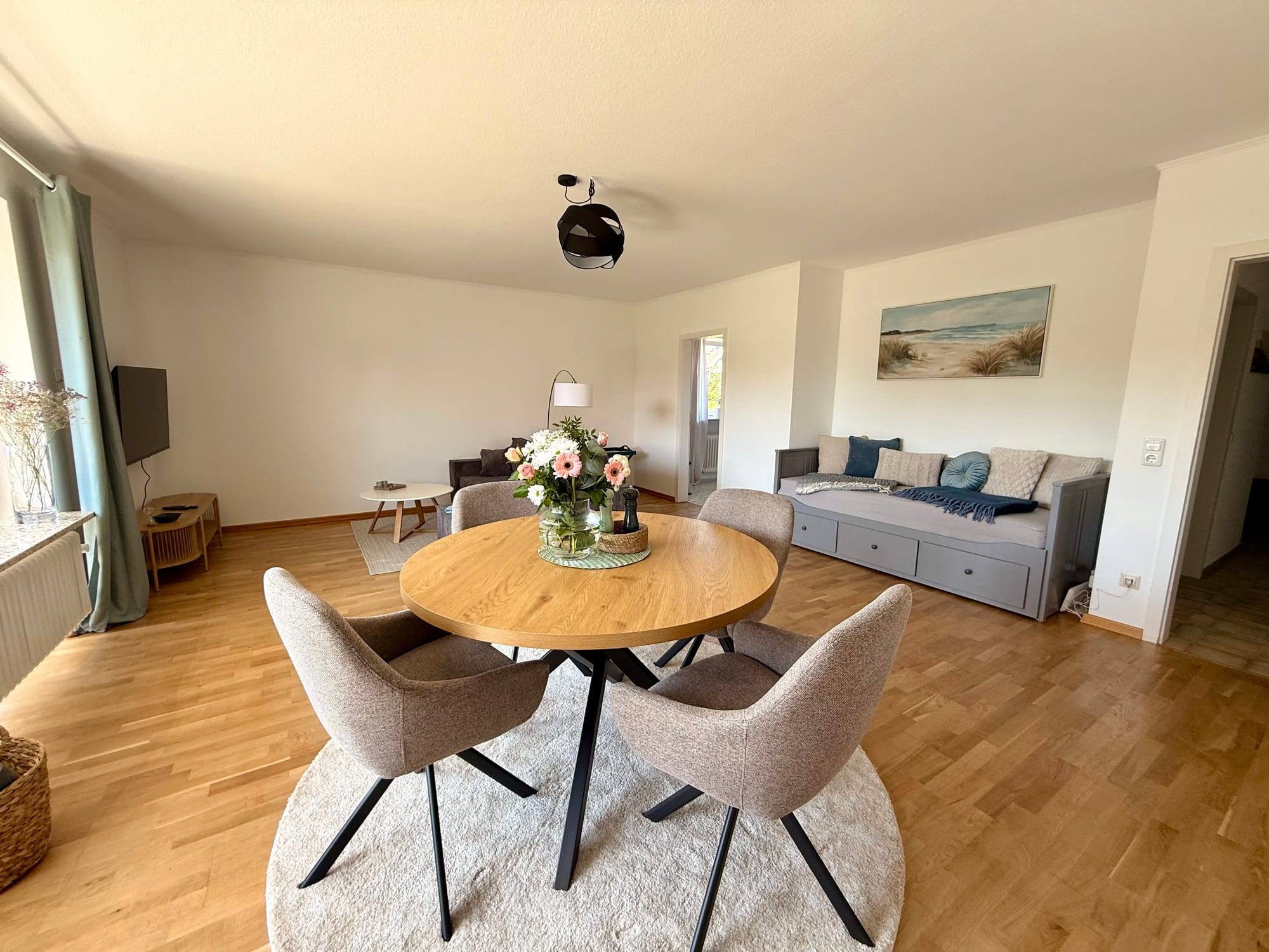 View across the living room with dining area and sofa