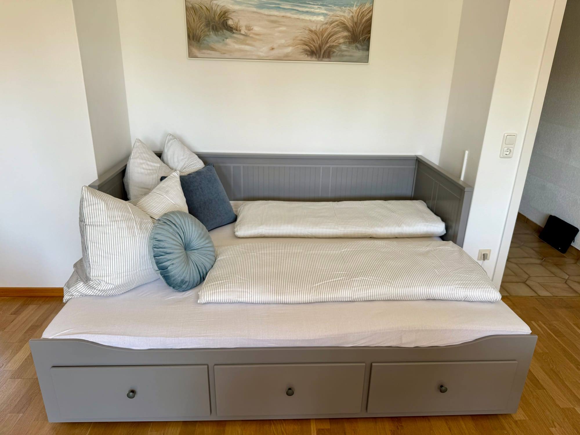 Extra bed in the living room with cushions